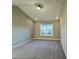 Carpeted bedroom with large window allowing for plenty of natural light at 1064 Fairhaven Dr # 95, Mebane, NC 27302