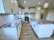 Modern kitchen with white cabinetry, granite countertops, and stainless steel appliances at 1064 Fairhaven Dr # 95, Mebane, NC 27302