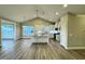 Modern kitchen boasts white cabinets, granite countertops, stainless steel appliances, and an island, connecting living spaces at 1064 Fairhaven Dr # 95, Mebane, NC 27302
