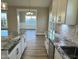 Stylish kitchen featuring granite counters, white cabinets, and stainless steel sink at 1064 Fairhaven Dr # 95, Mebane, NC 27302