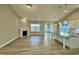 Spacious living room featuring a fireplace, large windows, and an island kitchen at 1064 Fairhaven Dr # 95, Mebane, NC 27302
