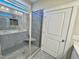 Modern tiled shower with glass door and a built-in seat at 1064 Fairhaven Dr # 95, Mebane, NC 27302
