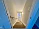 Staircase with carpet leading to a landing with light wood floors at 1064 Fairhaven Dr # 95, Mebane, NC 27302