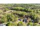 An aerial view showcases the property and its proximity to the lush green golf course at 132 Prairie Dog Dr, Louisburg, NC 27549
