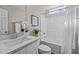 Bathroom featuring a white vanity with a marble countertop and a shower/tub combo at 132 Prairie Dog Dr, Louisburg, NC 27549