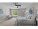 Serene bedroom with natural light, plush carpet, and a comfy bed for relaxation at 132 Prairie Dog Dr, Louisburg, NC 27549