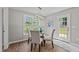 Dining room with a glass table, cushioned chairs, and lots of light at 132 Prairie Dog Dr, Louisburg, NC 27549