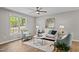 Bright living room featuring stylish furniture and a large window at 132 Prairie Dog Dr, Louisburg, NC 27549