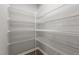 Walk-in pantry with metal shelving for optimized storage space at 132 Prairie Dog Dr, Louisburg, NC 27549