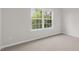 Bedroom featuring carpeted floors and a large window at 1688 Abberly Pl, Graham, NC 27253