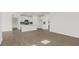 Open concept living room and kitchen with wood floors and neutral paint at 1688 Abberly Pl, Graham, NC 27253