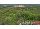 Expansive wooded lot surrounding the charming home, offering privacy and a natural setting at 200 Rawhide Dr, Louisburg, NC 27549