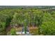 A birds eye view showcases the privacy of the home backed by a tall wooded area at 200 Rawhide Dr, Louisburg, NC 27549