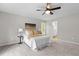 Comfortable bedroom with a fan and view into the bathroom and plenty of natural light at 200 Rawhide Dr, Louisburg, NC 27549