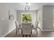 Bright dining room features a modern chandelier and a large window with a view of the outdoors at 200 Rawhide Dr, Louisburg, NC 27549