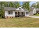 Inviting one-story home with black accents and a neatly kept lawn, perfect for curb appeal at 200 Rawhide Dr, Louisburg, NC 27549
