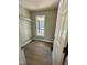 Bright laundry room features wood-look flooring, neutral paint, and a window for natural light at 200 Rawhide Dr, Louisburg, NC 27549