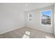 Empty bedroom with neutral carpet and two bright windows at 909 Montague Ave, Durham, NC 27703