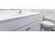 Bathroom vanity with a white countertop, undermount sink, white cabinets, and brushed nickel hardware at 105 Wilderness Ct, Mebane, NC 27302