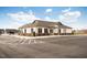 Exterior of a neighborhood clubhouse with ample parking and well-manicured landscaping at 105 Wilderness Ct, Mebane, NC 27302