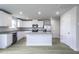 Well-lit kitchen featuring stainless steel appliances, granite countertops, and a center island at 105 Wilderness Ct, Mebane, NC 27302
