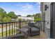 Inviting balcony with outdoor seating provides views of a neighborhood with modern townhomes at 10535 Pleasant Branch Dr # 201, Raleigh, NC 27614