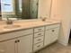 Bright bathroom with double sink vanity, quartz countertop and modern fixtures at 1600 Maelyn Way, Fuquay Varina, NC 27526