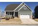 Charming craftsman-style home featuring a two-car garage and inviting front porch at 1600 Maelyn Way, Fuquay Varina, NC 27526