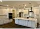 Bright, newly renovated kitchen with stainless steel appliances, quartz countertops, and modern cabinetry at 1600 Maelyn Way, Fuquay Varina, NC 27526
