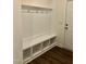 Mud room with storage, hanging hooks, bench, and hardwood floors at 1600 Maelyn Way, Fuquay Varina, NC 27526