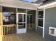 Screened-in porch with wood flooring offers an indoor-outdoor experience and a view of the home's exterior at 1600 Maelyn Way, Fuquay Varina, NC 27526