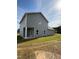 Rear view of the house showing a covered patio and siding at 178 Vili Dr, Broadway, NC 27505
