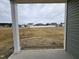 View from back porch overlooking a spacious backyard and neighborhood beyond at 178 Vili Dr, Broadway, NC 27505