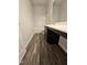 Bathroom featuring wood-look floors, a modern vanity, and a tub/shower combo at 178 Vili Dr, Broadway, NC 27505