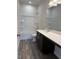 Bathroom features a single vanity and tub/shower combo with tile at 178 Vili Dr, Broadway, NC 27505