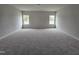Bedroom with neutral carpet and walls and two windows at 178 Vili Dr, Broadway, NC 27505