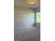 Bright, carpeted bedroom with a view of the outdoors from its window at 178 Vili Dr, Broadway, NC 27505