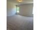 Spacious carpeted bedroom with natural light from two windows at 178 Vili Dr, Broadway, NC 27505