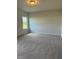 Spacious bedroom with plush carpeting and ample natural light from the window at 178 Vili Dr, Broadway, NC 27505