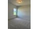 Small carpeted bedroom with a window providing natural light at 178 Vili Dr, Broadway, NC 27505