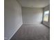 Bedroom with neutral carpet and walls and one window at 178 Vili Dr, Broadway, NC 27505