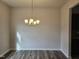 Dining room has stylish light fixture, hardwood flooring and neutral paint, perfect for entertaining at 178 Vili Dr, Broadway, NC 27505