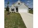 Charming two-story home featuring a two-car garage and well-maintained front lawn at 178 Vili Dr, Broadway, NC 27505