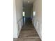 Hallway with wood-look floors and decorative wainscoting at 178 Vili Dr, Broadway, NC 27505