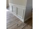 Hallway with wood-look floors and decorative wainscoting at 178 Vili Dr, Broadway, NC 27505