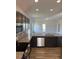 Modern kitchen with stainless steel appliances, dark wood cabinets, and granite countertops at 178 Vili Dr, Broadway, NC 27505