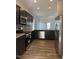 Modern kitchen with stainless steel appliances, dark wood cabinets, and granite countertops at 178 Vili Dr, Broadway, NC 27505