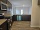 Well-equipped kitchen with stainless steel appliances, granite countertops, and ample cabinet space at 178 Vili Dr, Broadway, NC 27505