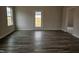Bright living room with a window and back door features hardwood flooring and neutral walls at 178 Vili Dr, Broadway, NC 27505
