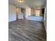 Open floor plan with hardwood floors, leading to the kitchen and stairs at 178 Vili Dr, Broadway, NC 27505